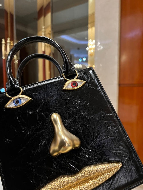 “Visage d’Or” Face Bag by Schiaparelli