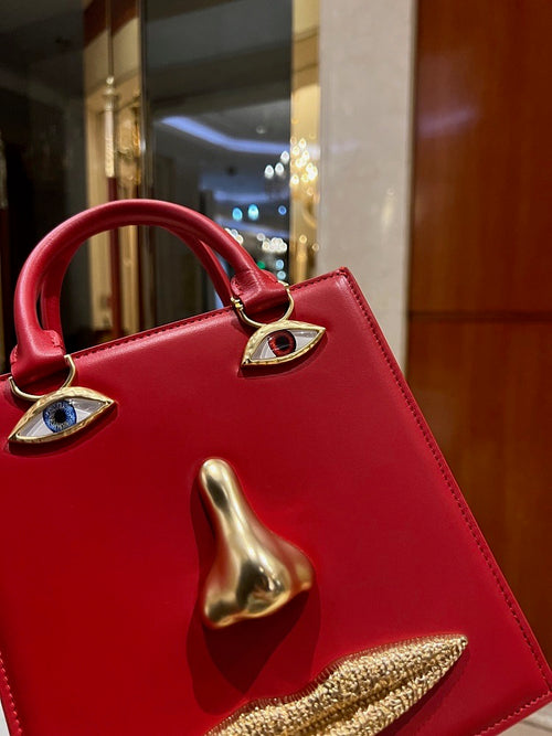 “Visage Rouge” Sculptural Face Bag by Schiaparelli