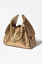 Chanel 25 “Gilded Quilts” Drawstring Bag in Metallic Gold