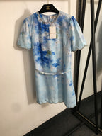 “Isola Solstice” Crystal-Trimmed Mini Dress Available in Sunset Blush & Blue Mirage