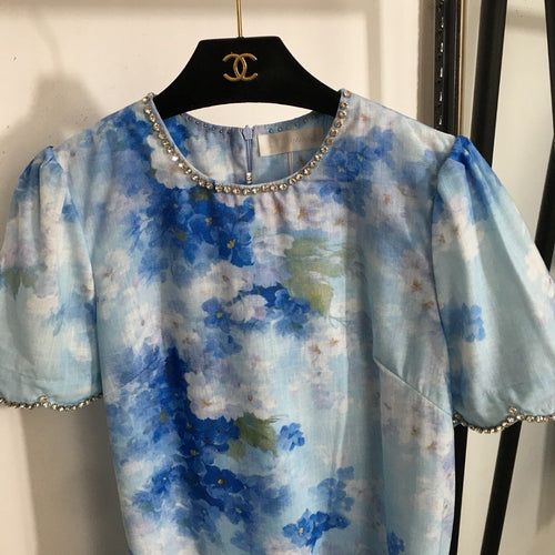 “Isola Solstice” Crystal-Trimmed Mini Dress Available in Sunset Blush & Blue Mirage