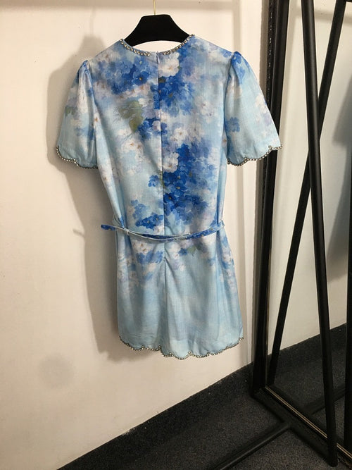 “Isola Solstice” Crystal-Trimmed Mini Dress Available in Sunset Blush & Blue Mirage