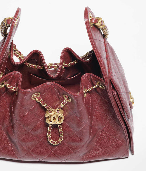 Chanel “Rouge Caviar” Mini Bucket Flap Bag Mini Edition in Bordeaux Caviar Calfskin with Gold Hardwar