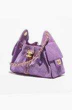 Chanel “Éclat Lavande” Suede Quilted Drawstring Mini Bag