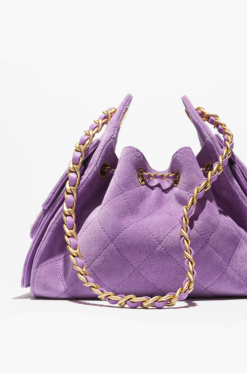 Chanel “Éclat Lavande” Suede Quilted Drawstring Mini Bag