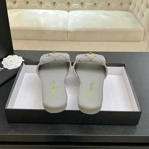 Chanel Quilted Canvas Slides – Sable Élégance