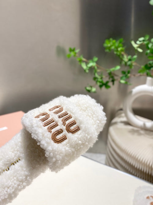 Miu Miu Shearling Logo Slide Slippers in Ivory