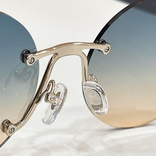 Prada Aurelia Stud Rimless Sunglasses
