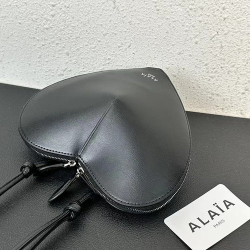 Alaïa Paris Heart-Shaped Patent Leather Crossbody Bag