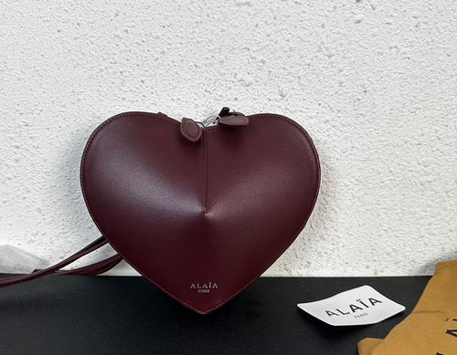 Alaïa Paris Heart-Shaped Patent Leather Crossbody Bag