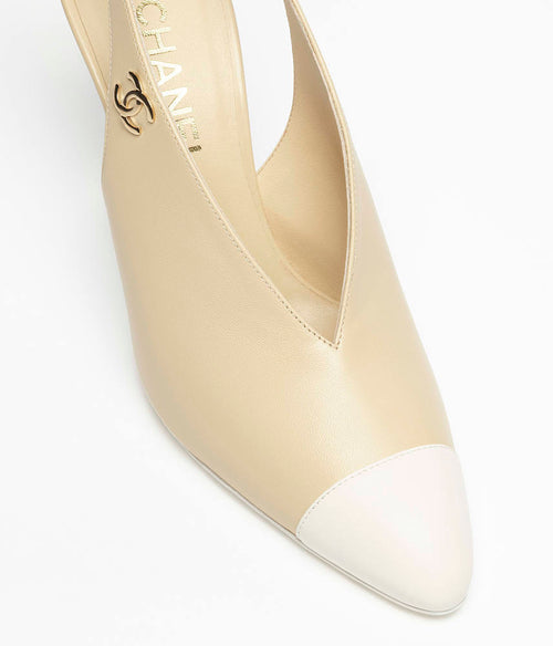 CHANEL Métiers d’Art 2026 “Aile de Camélia” Cap-Toe Slingback Pumps – Ivory &amp; Blanc