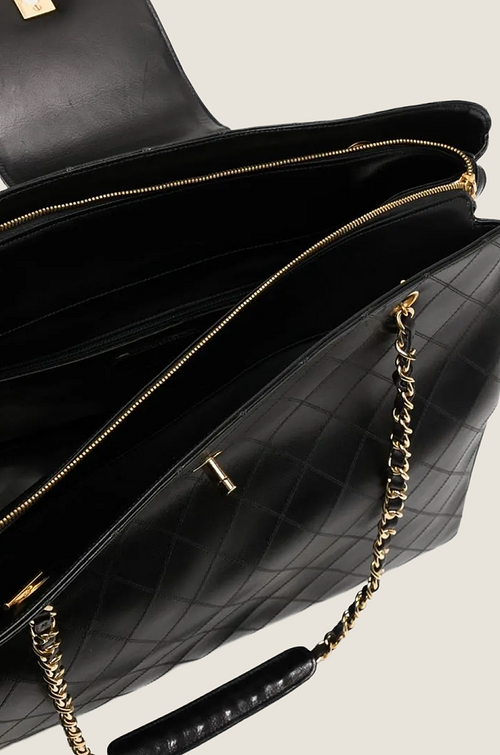 Chanel “Grand Voyage” Quilted Leather Tote