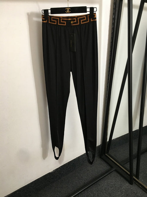 “Greca Linea” Stirrup Leggings by Versace