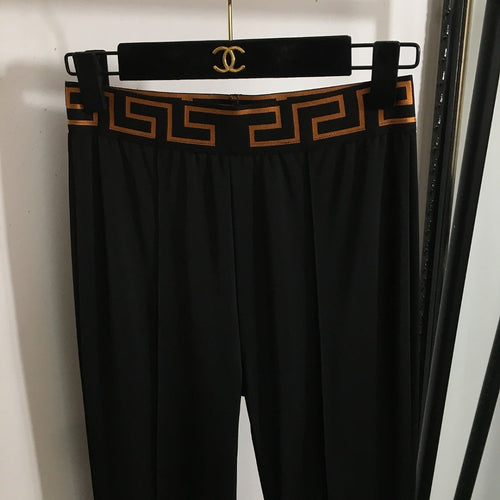 “Greca Linea” Stirrup Leggings by Versace