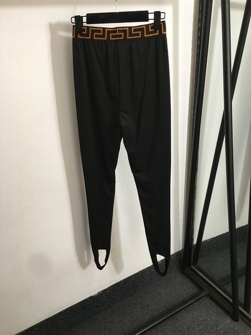 “Greca Linea” Stirrup Leggings by Versace