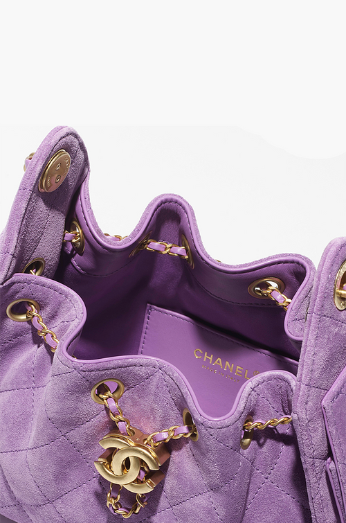 Chanel “Éclat Lavande” Suede Quilted Drawstring Mini Bag