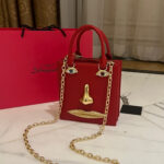 “Visage Rouge” Sculptural Face Bag by Schiaparelli